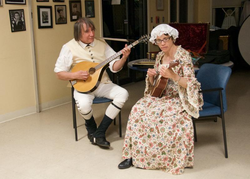 The Buzzards Bay Buccaneers, Bob Littera and Kelly Reed-Hathaway, perform colonial music. BY GEORGIA SPARLING
